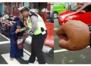 Emak-emak Ini Gigit Polisi Karena Tak Terima Ditilang, Videonya Viral