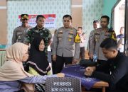 Bakti Sosial, Polres Nganjuk Salurkan Sembako dan Pengobatan Gratis Untuk Warga Desa Kwagean